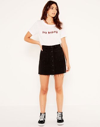 white print tee with black button front denim skirt