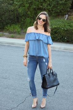 denim of shoulder blouse with blue cuffed skinny jeans