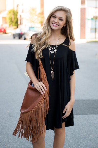 black cold shoulder mini dress with brown fringe bag