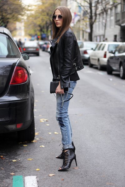 black blazer with gray-blue skinny jeans cutout boots