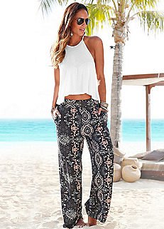 white cropped make-up top with black tribal printed beach trousers