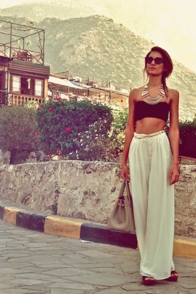 black cropped tube top with white wide leg trousers