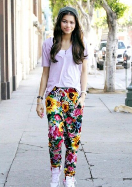 gray t-shirt with floral baggy pants and white high top sneakers