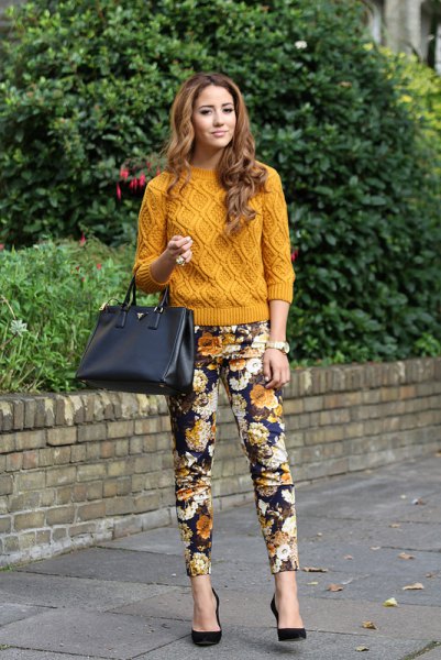 green knitted sweater with black floral pants