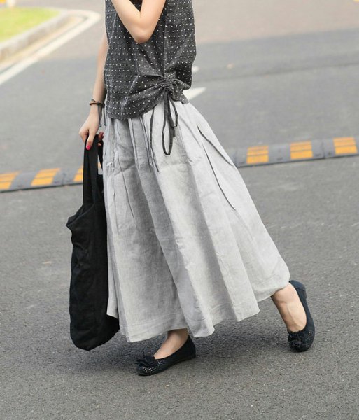 black and white polka dot sleeveless blouse with light gray maxi linen skirt