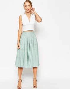 white deep v-sleeveless crop top with gray linen skirt
