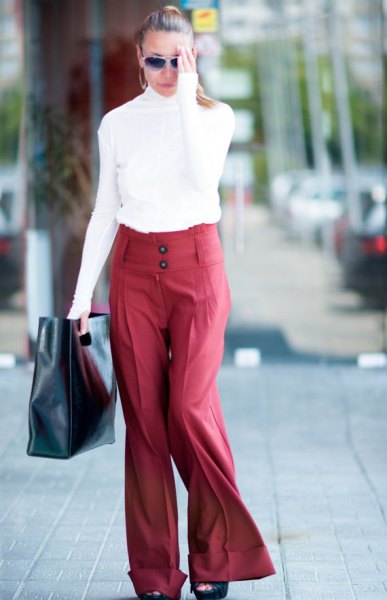 white mock neck long sleeve top with red wide leg pants
