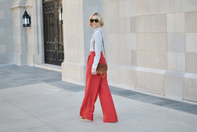 black and white striped shirt with red wide leg trousers