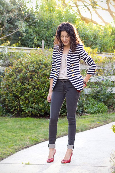 black and white horizontal striped double breasted blazer with gray jeans