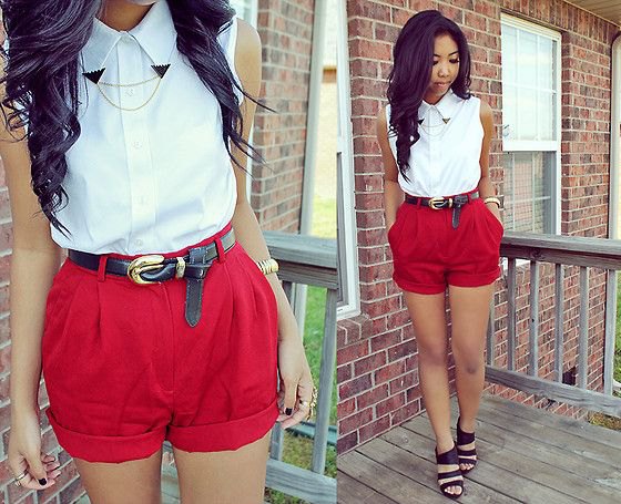 white sleeveless button up shirt with red high waist shorts