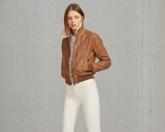 brown shearling bomber jacket with heather gray tee-white jeans