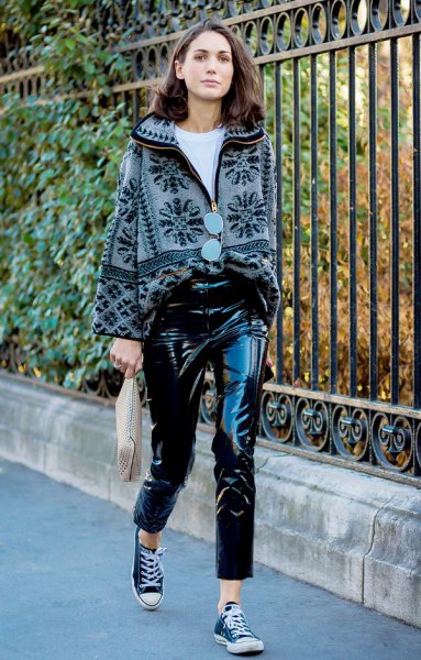 printed sweater with black leather pants