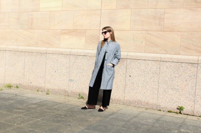 gray long linen jacket with black wide leg trousers