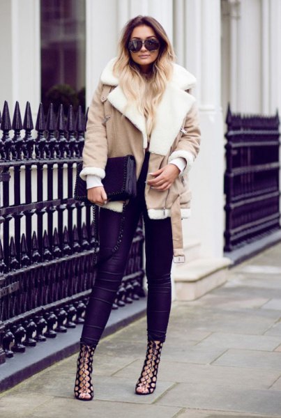 pink shearling jacket with dark blue skinny jeans