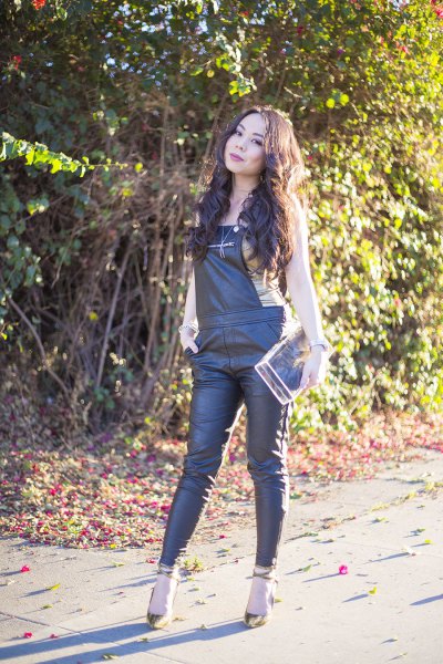 black leather overalls with light pink sleeveless top