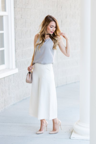 pink sleeveless blouse with white culottes