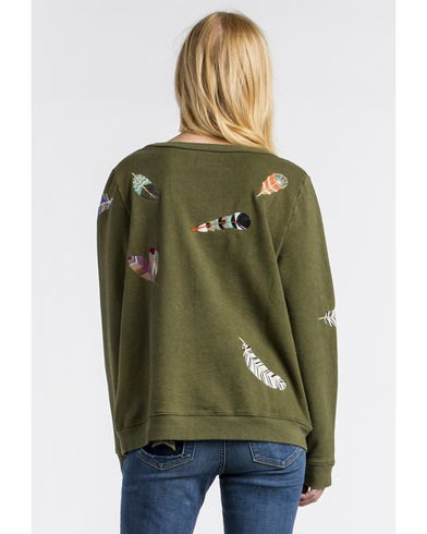 green cartoon embroidered sweater with matching slim jeans