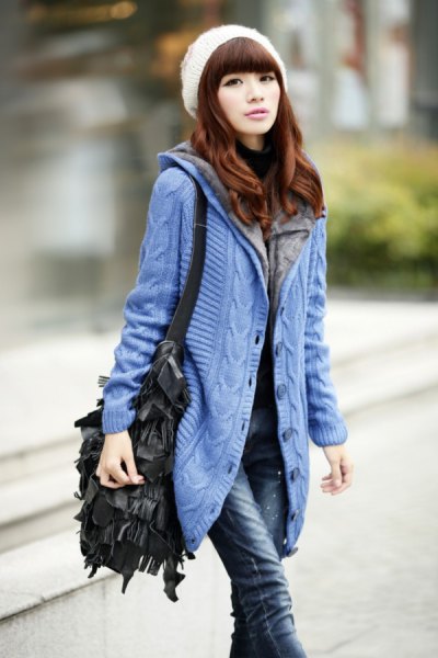 blue hooded cardigan with white knitted hat
