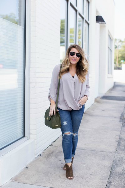 pink wrap blouse with ripped skinny jeans