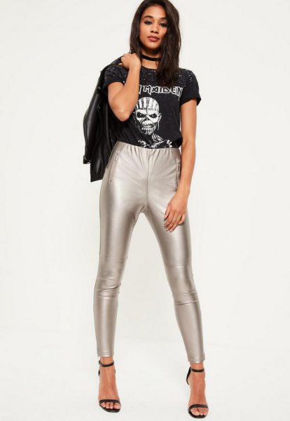 black print tee with leather jacket and silver leggings