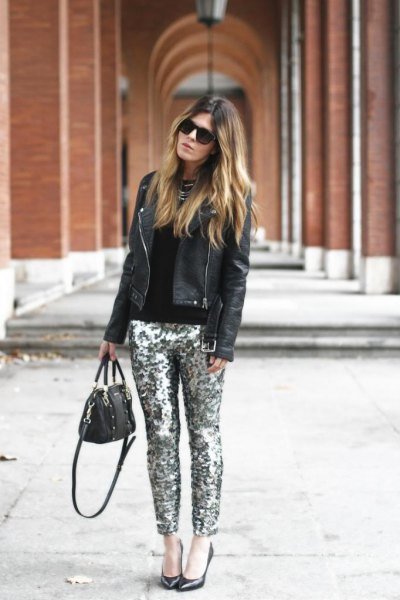 black leather jacket with fitted sweater and silver pants