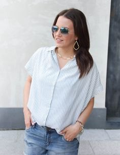 gray and white striped short sleeve shirt with jeans and gold choker necklace