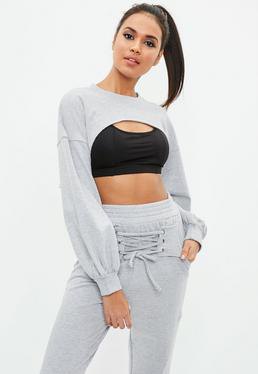 gray hooded sweatshirt with black sports bra top