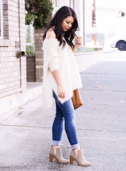 white a shoulder knit sweater blue cuffed jeans