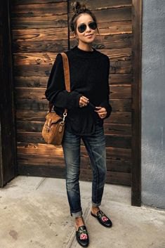 black sweater in cuff in cuffed skinny jeans with embroidered loafers