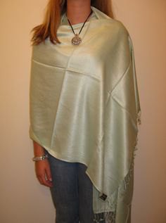 silver shawl white vest top blue skinny jeans