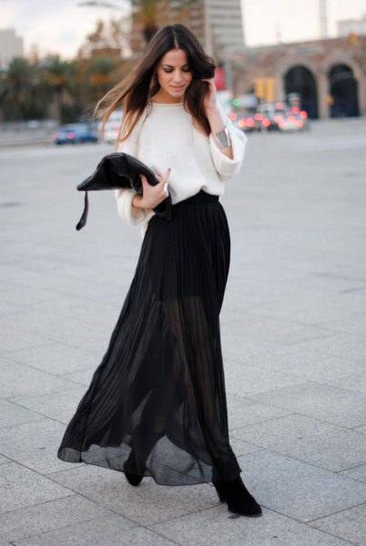 white sweater with wide sleeve, black clean skirt