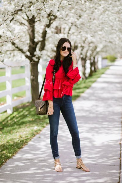 red comfy blouse cuffed skinny jeans