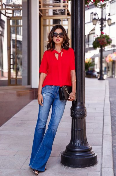 red tie neck blouse blue puffed jeans