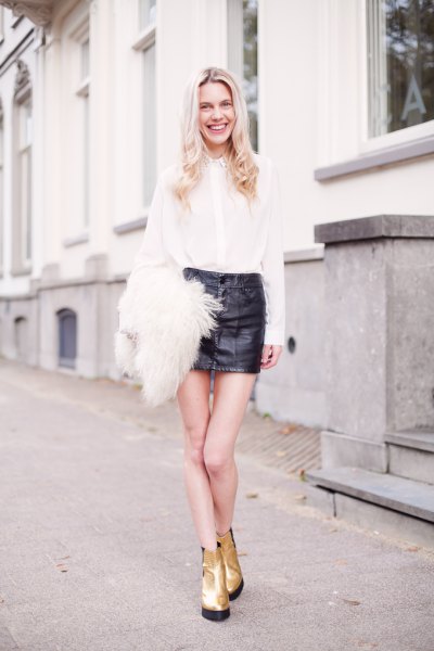 white shirt black mini leather skirt gold boots