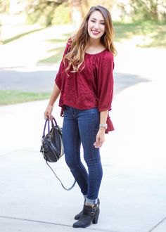 red jersey blouse in cuffed jeans