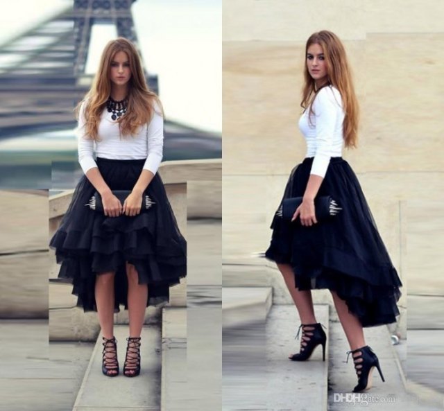 white form fitting sweater black tulle high low skirt