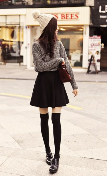 gray knitted sweater black skater skirt