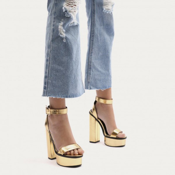 ripped flared jeans gold platform heels