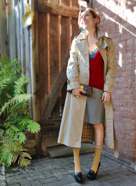 black loafers red sweater beige long trench coat