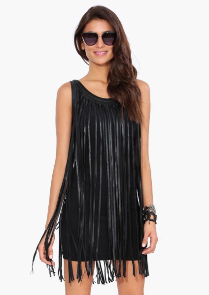 black sleeveless dress with long fringes