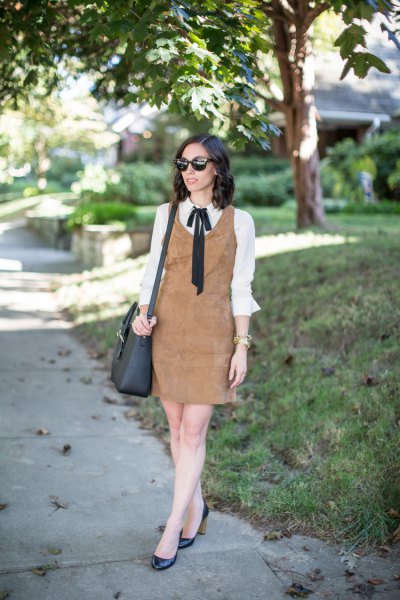 brown suede dress over white bow shirt
