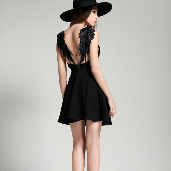 backless black skater dress with angel wings design