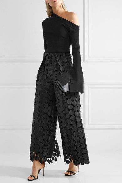 black lace trousers over one shoulder