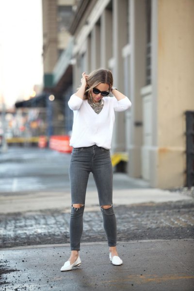 white v-neck knitted sweater gray ripped jeans