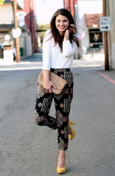 white long sleeve top black printed trousers