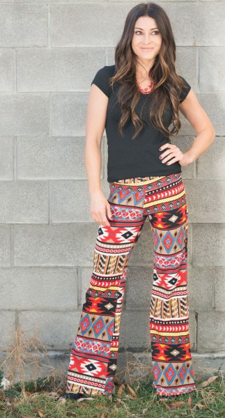 black t-shirt colorful tribal printed pants