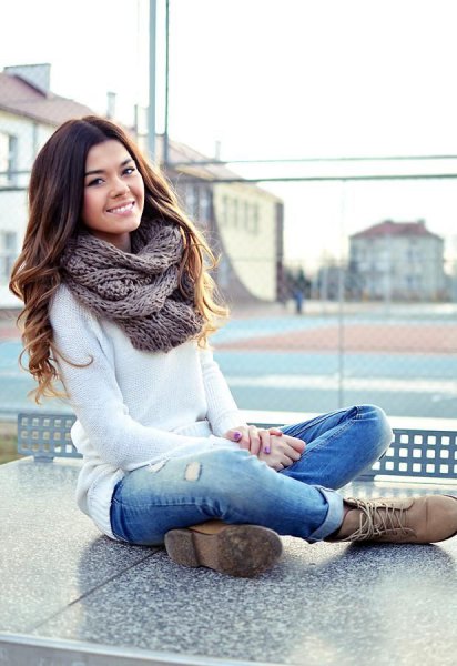 white knitted sweater cuffed jeans