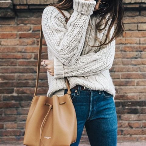 partially tucked into chunky sweater outfit