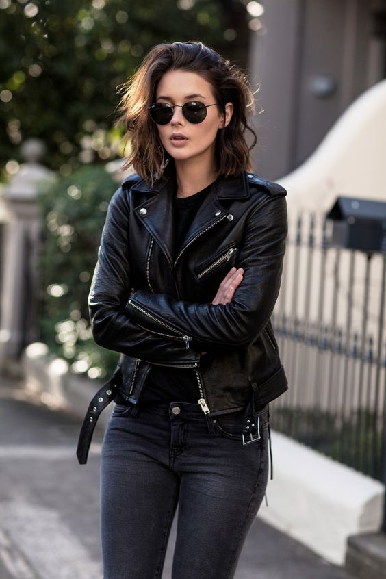 black leather moto jacket gray jeans