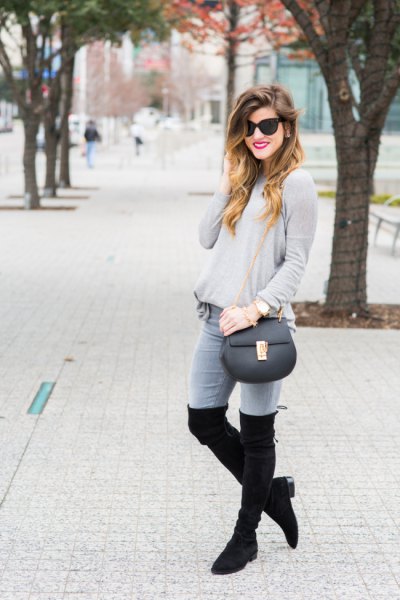 gray sweater jeans high boots